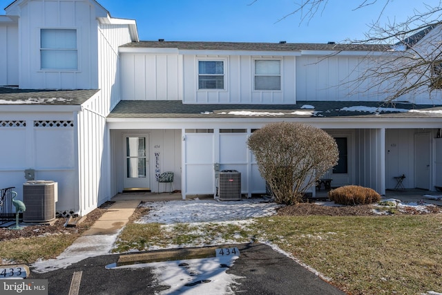 townhome / multi-family property with a garage and central AC