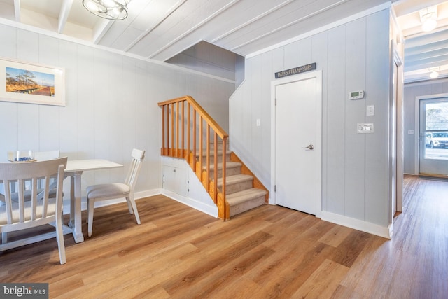 interior space featuring beamed ceiling and light wood-type flooring