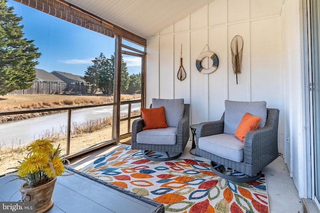 sunroom featuring vaulted ceiling