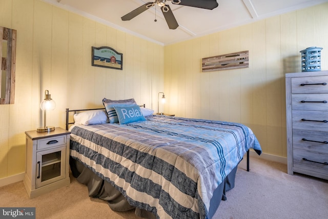 bedroom featuring ornamental molding, light colored carpet, and ceiling fan