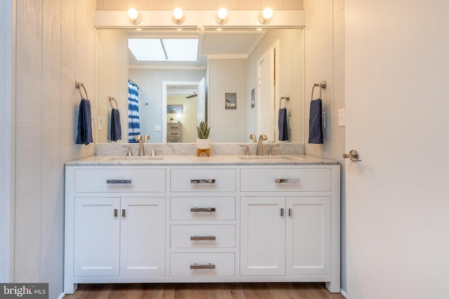 bathroom featuring hardwood / wood-style flooring and vanity