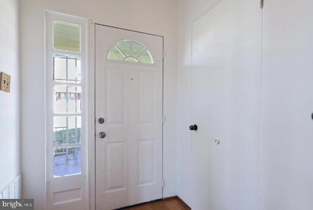 foyer with dark hardwood / wood-style flooring