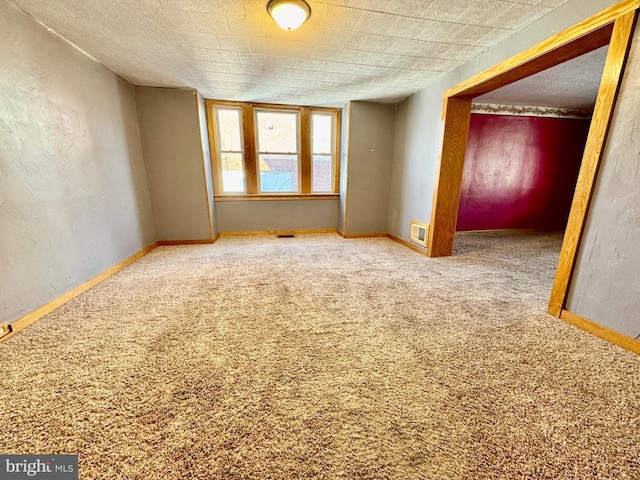 spare room with carpet flooring