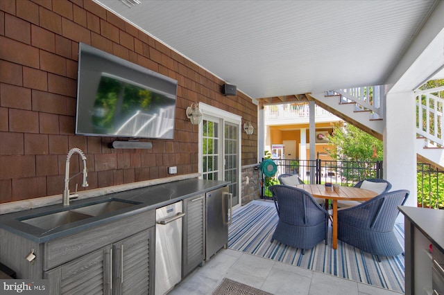 view of patio / terrace with exterior kitchen and sink