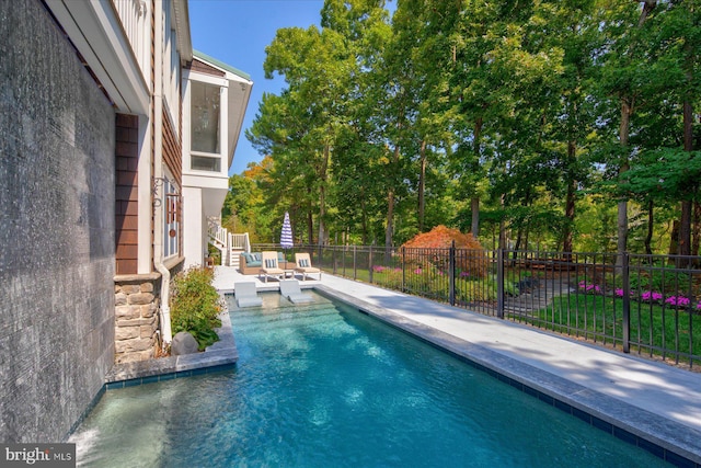 view of swimming pool featuring an outdoor hangout area