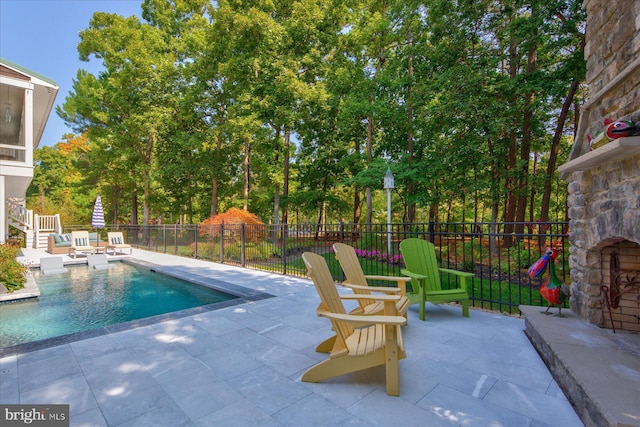 view of swimming pool featuring a patio area