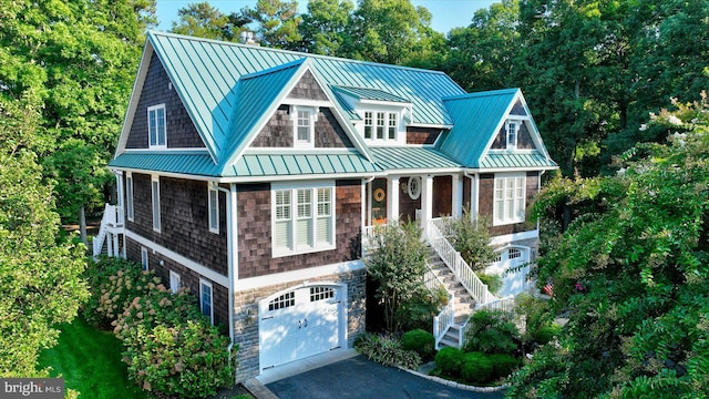 view of front facade with a garage and covered porch