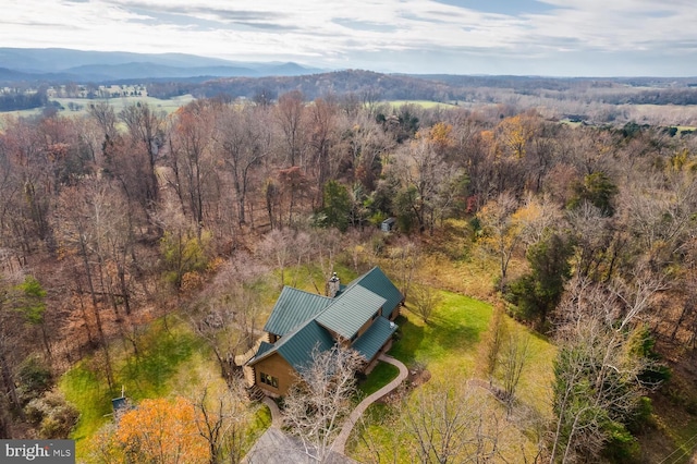 aerial view with a forest view and a mountain view