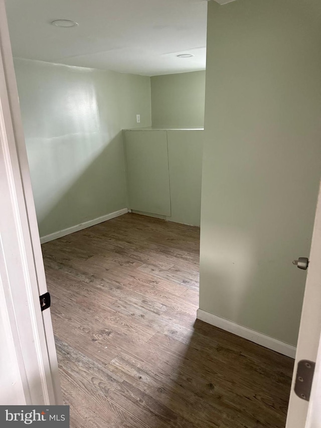 empty room with wood-type flooring