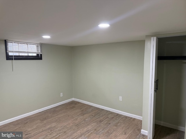 basement featuring hardwood / wood-style flooring