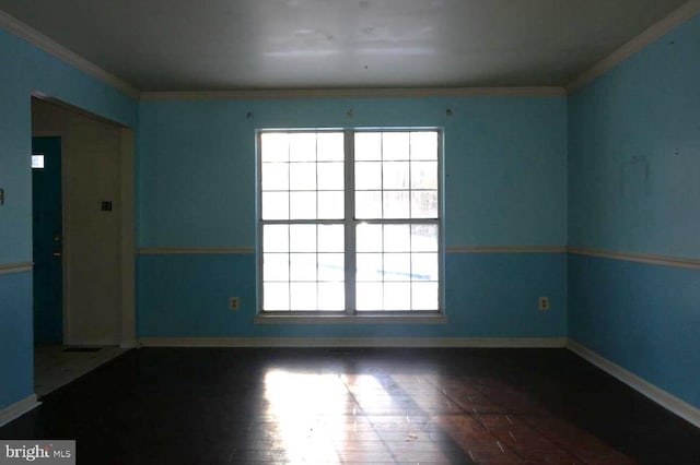 empty room with plenty of natural light and ornamental molding