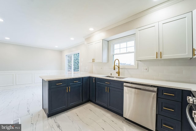 kitchen with white cabinetry, sink, stainless steel dishwasher, kitchen peninsula, and crown molding