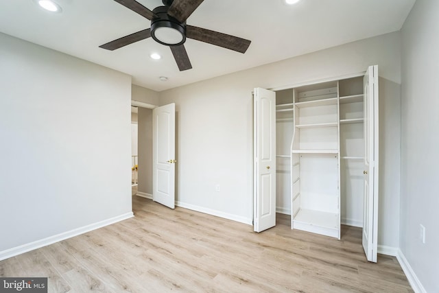 unfurnished bedroom with ceiling fan, a closet, and light hardwood / wood-style flooring