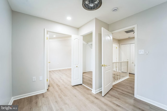 hall with light wood-type flooring