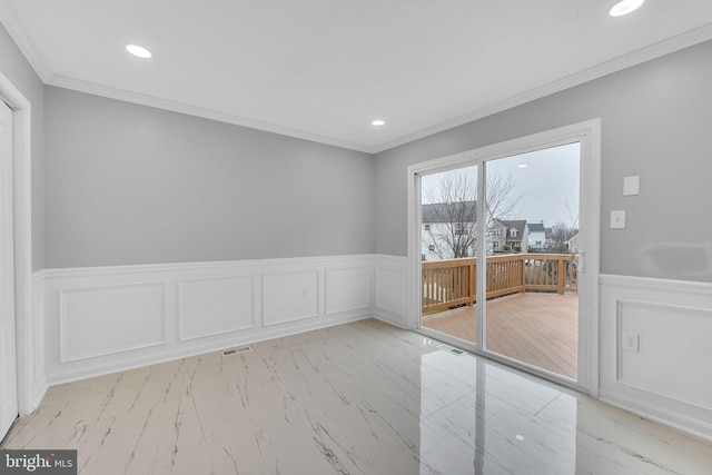 empty room featuring ornamental molding