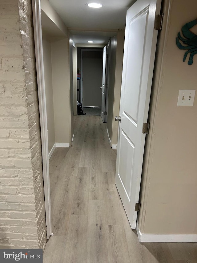 hallway featuring light hardwood / wood-style flooring