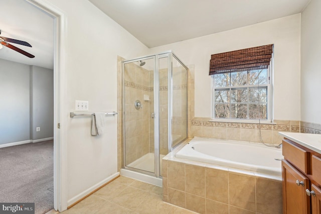 bathroom with ceiling fan, vanity, separate shower and tub, and tile patterned flooring