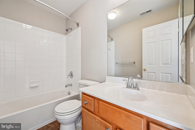 full bathroom featuring vanity, shower / bathtub combination, and toilet