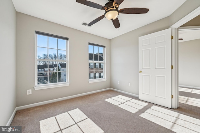 unfurnished bedroom with light carpet and ceiling fan