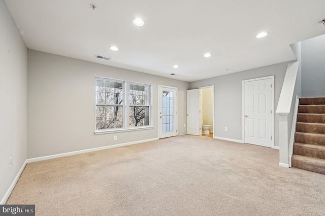 spare room with light colored carpet