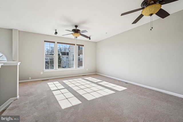 unfurnished room with ceiling fan and light colored carpet