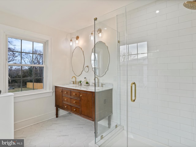 bathroom with vanity and a shower with shower door