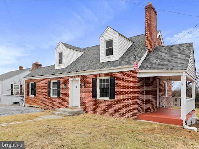 new england style home with a front yard