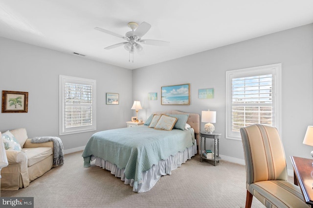 carpeted bedroom with ceiling fan