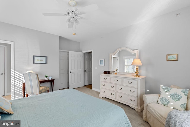 bedroom with ceiling fan and light colored carpet