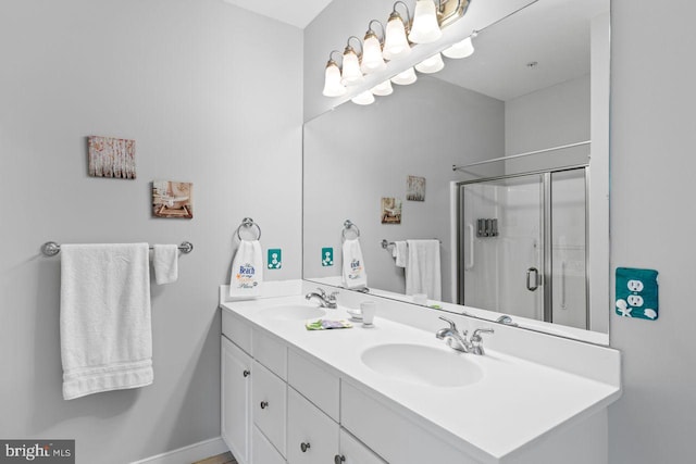 bathroom featuring vanity and a shower with shower door