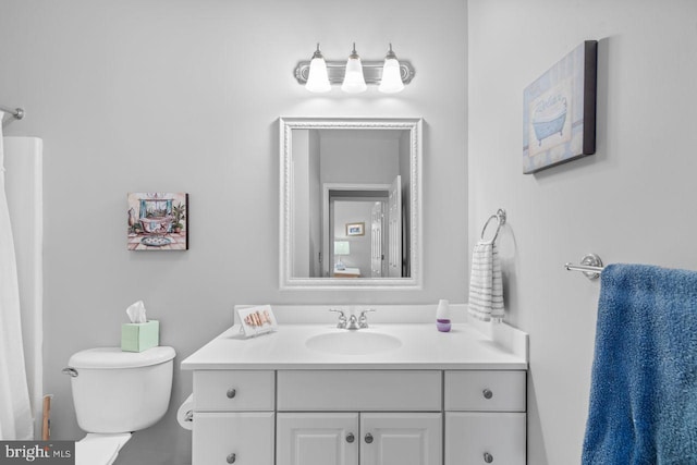 bathroom with vanity and toilet