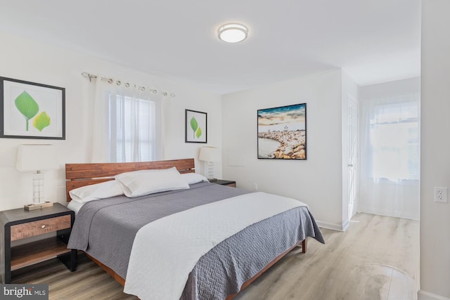 bedroom with light wood-type flooring