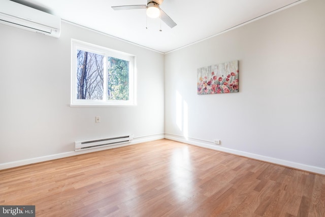 empty room featuring a wall mounted air conditioner, a baseboard radiator, light hardwood / wood-style floors, and ceiling fan