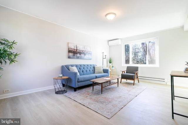 living room with a wall mounted AC and light hardwood / wood-style floors