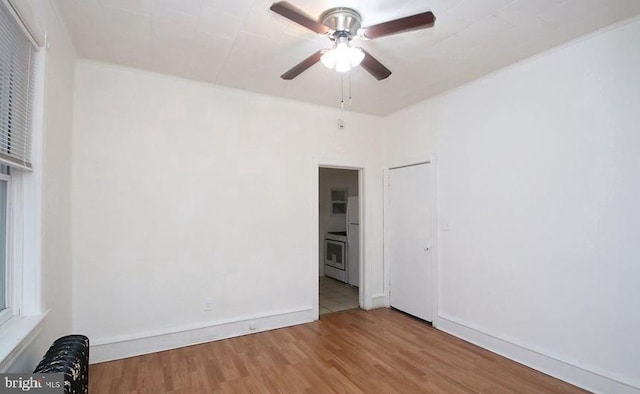 unfurnished room featuring ceiling fan and light wood-type flooring