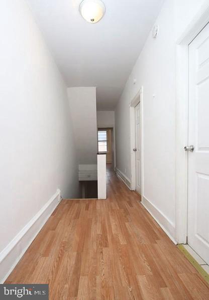 hallway featuring light hardwood / wood-style flooring