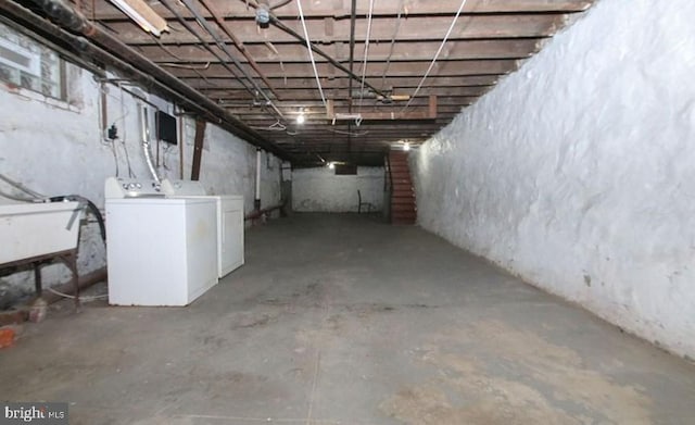 basement featuring sink and washer and clothes dryer