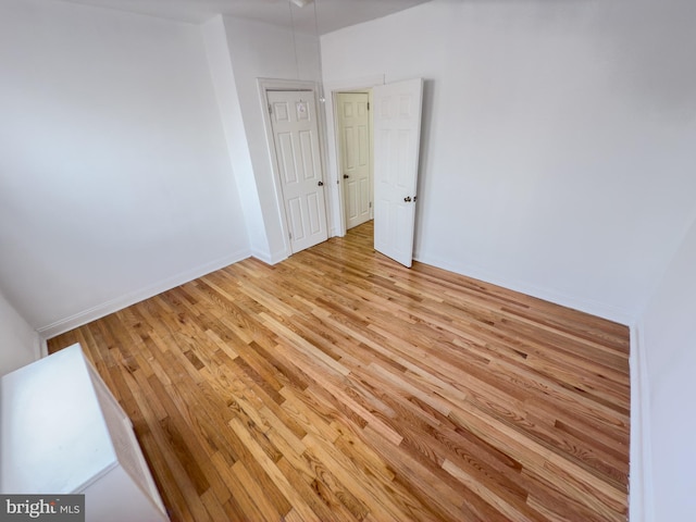 spare room with light wood-type flooring