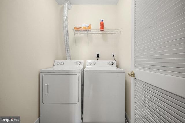 laundry area with separate washer and dryer