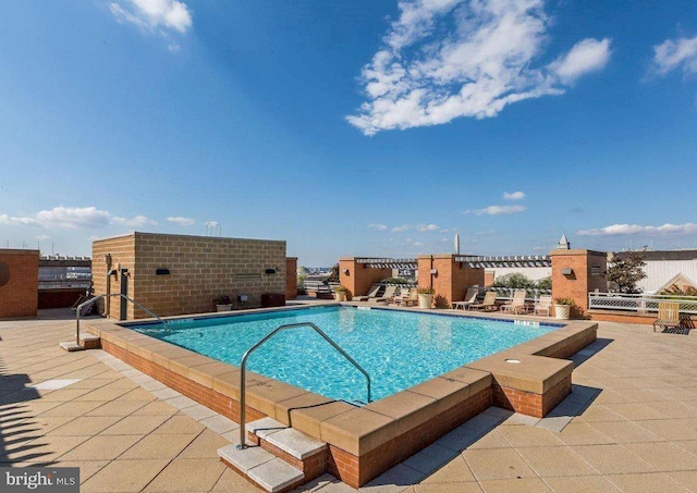 view of swimming pool featuring a patio area