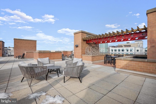 view of patio / terrace featuring outdoor lounge area and a pergola