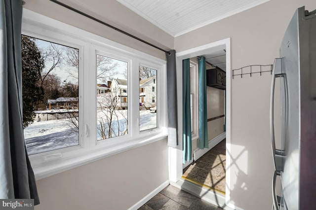 doorway to outside featuring ornamental molding