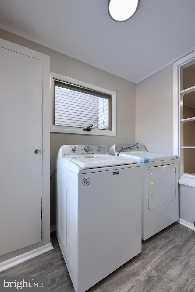 laundry room featuring wood-type flooring and washing machine and clothes dryer