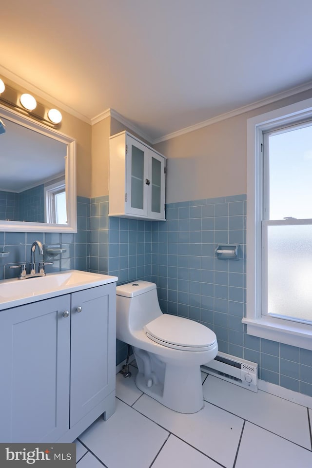 bathroom with tile walls, tile patterned flooring, a wealth of natural light, and crown molding