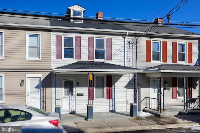 townhome / multi-family property with covered porch