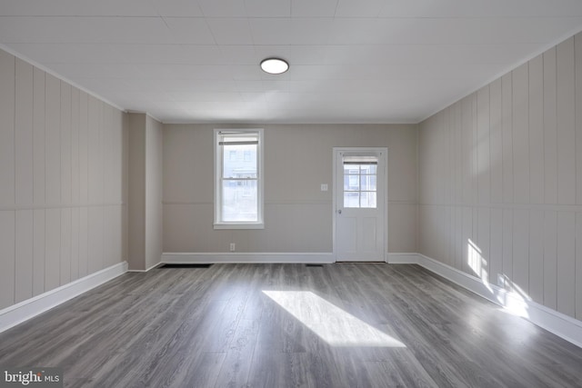 empty room featuring wood-type flooring