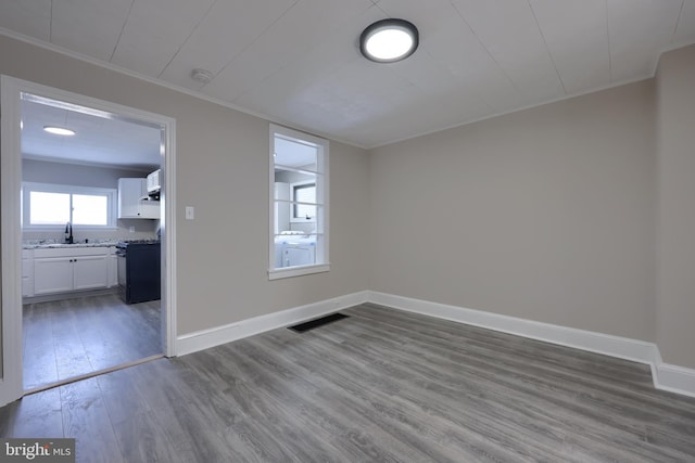 spare room featuring hardwood / wood-style floors