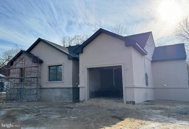 view of side of property with a garage