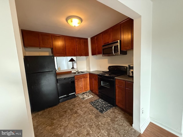 kitchen with sink and black appliances