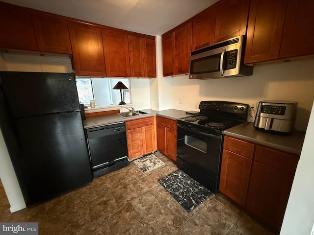 kitchen with sink and black appliances